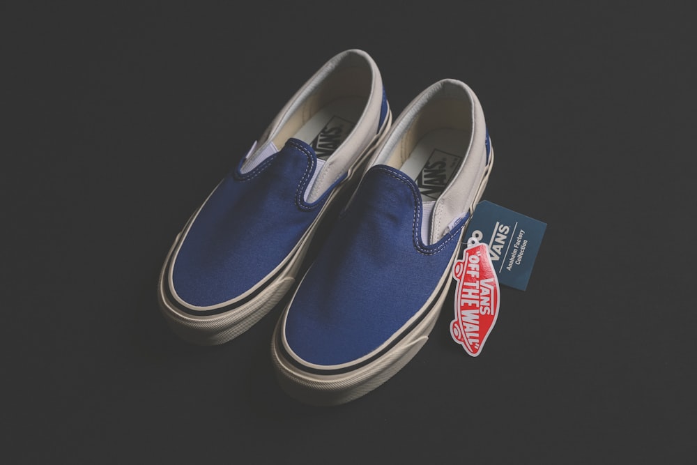 pair of blue Vans low-top sneakers