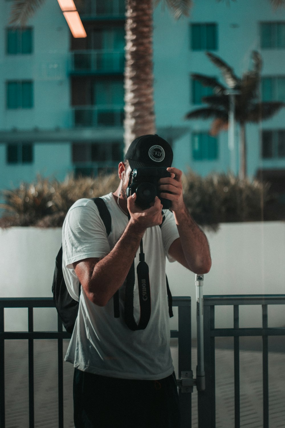 man holding DSLR camera