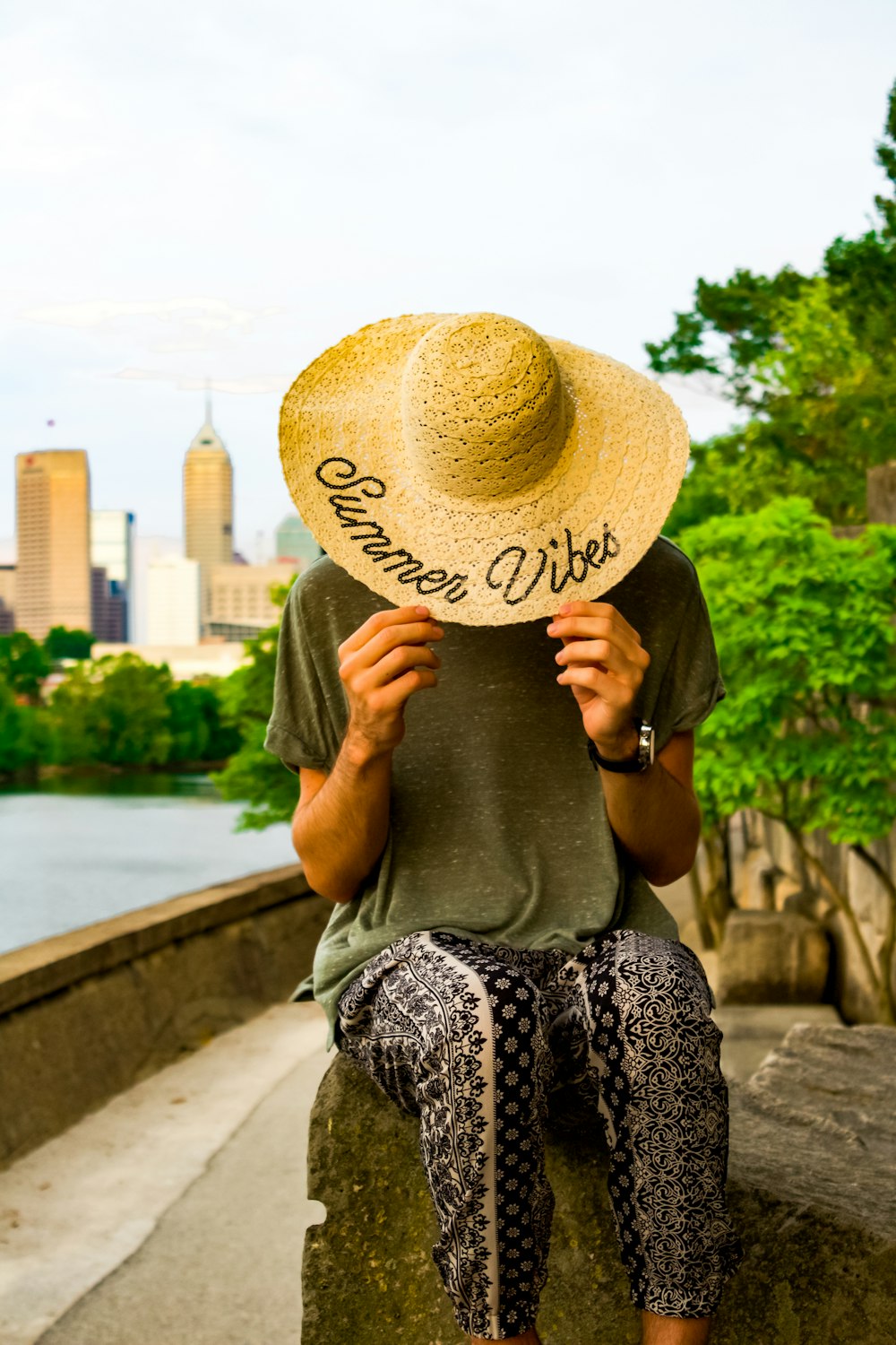 woman hiding her face using hat