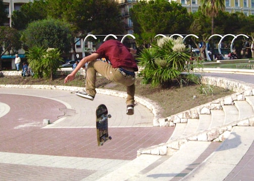 Dynamic footage of a skateboarder performing tricks in an urban park.