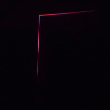A modern contact form on a dark background with fuchsia accents.