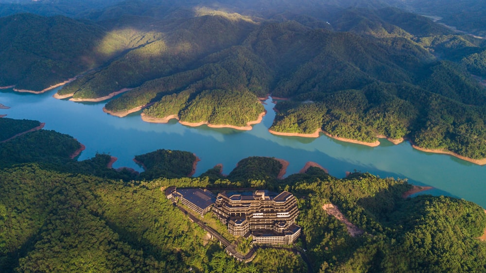 gray concrete building near body of water aerial photography