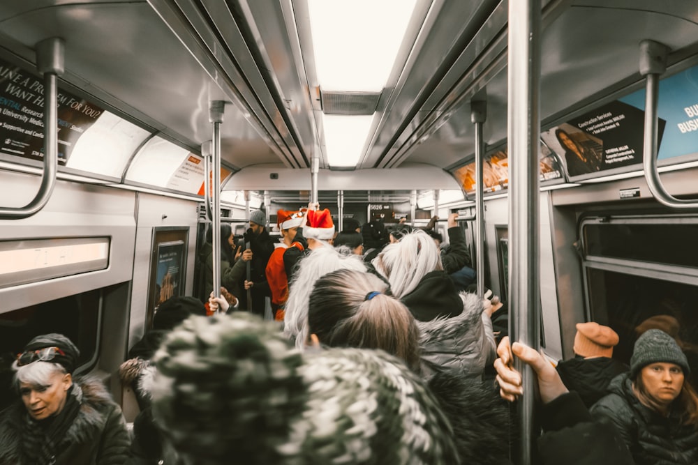 group of people riding train