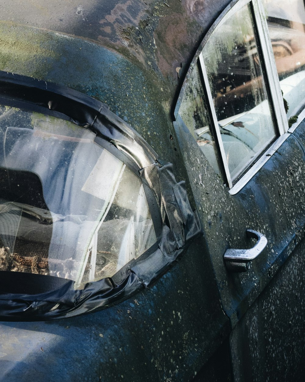 rusted black vehicle