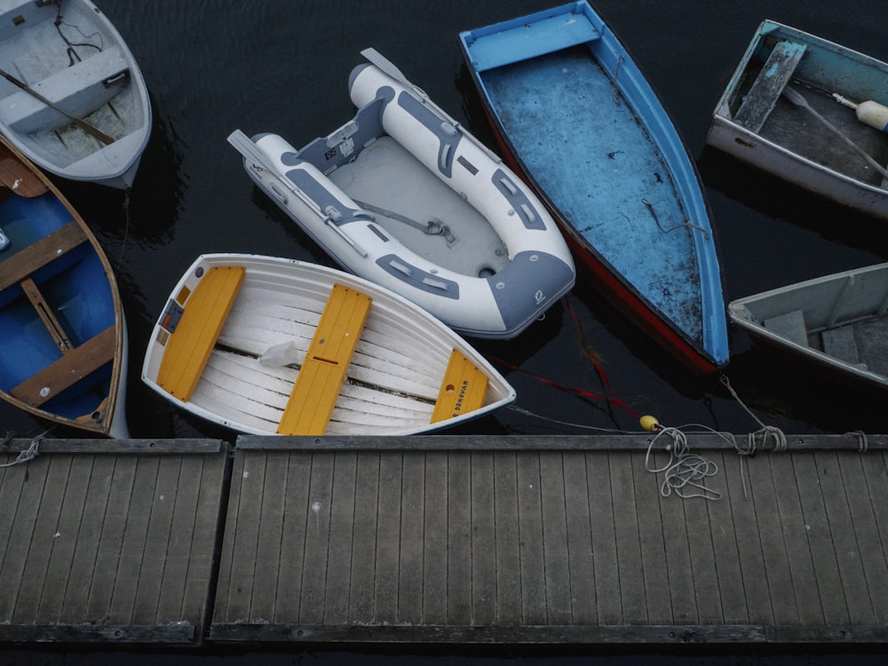 assorted-color boats on body of water