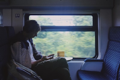 woman sitting on train chair