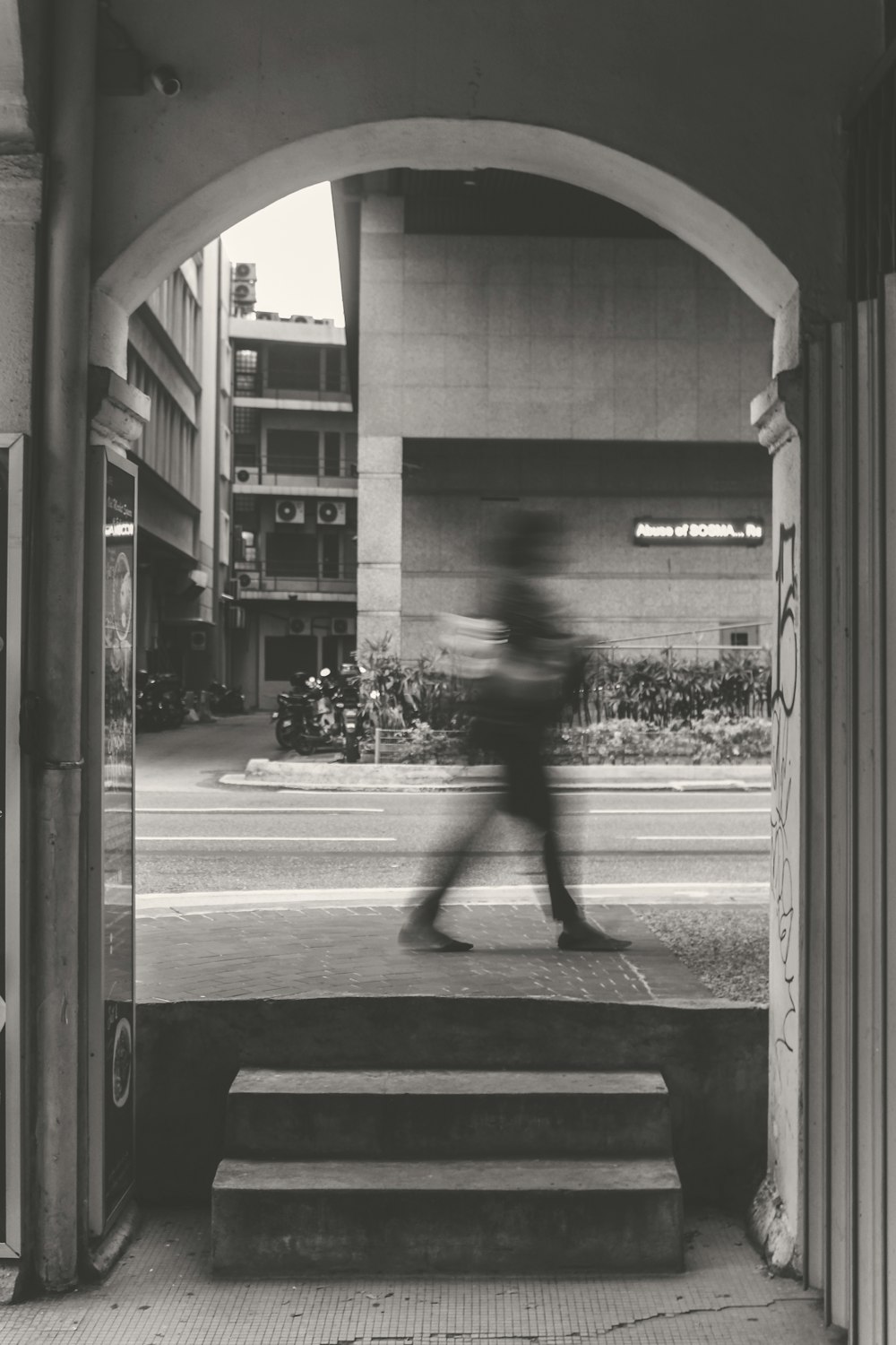 person walking at road during daytime