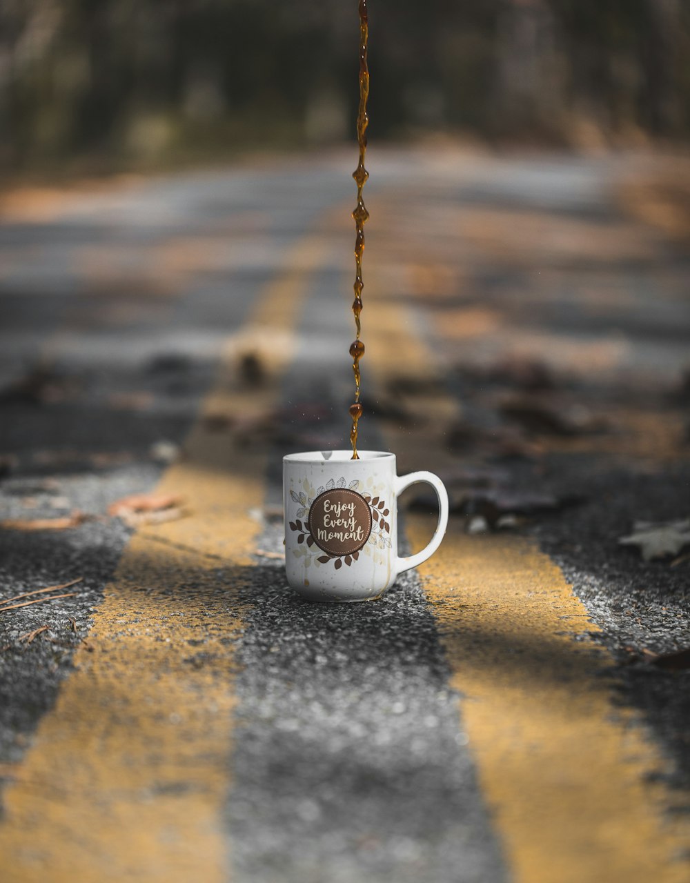 white and brown ceramic coffee cup