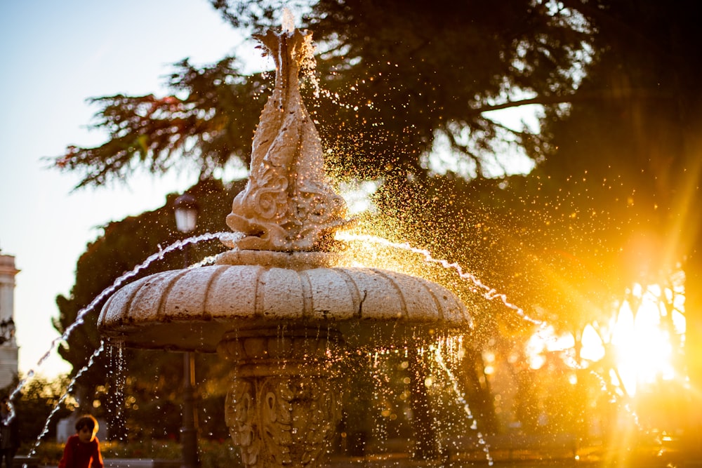 beige ceramic fountain