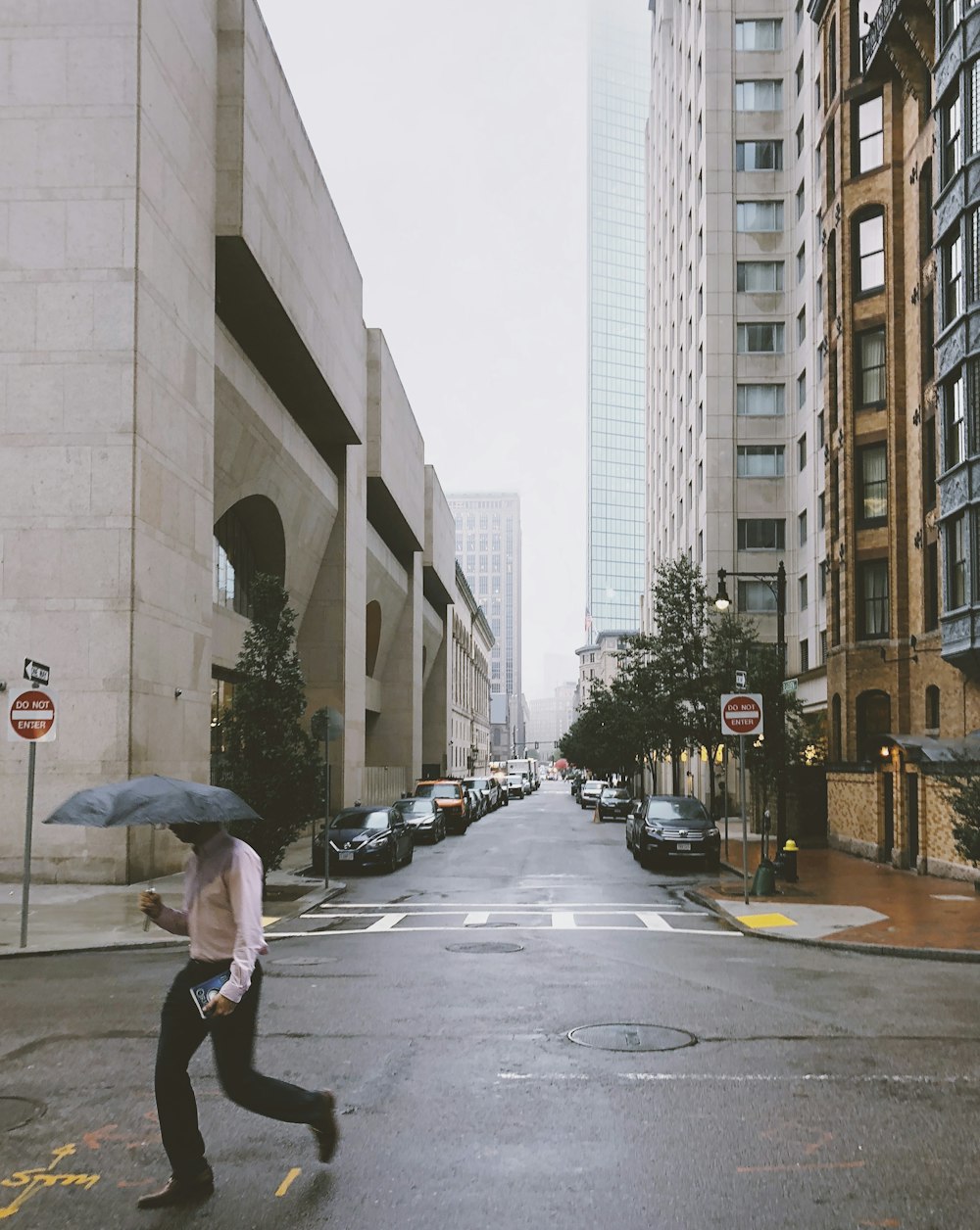 man walking on street during daytime