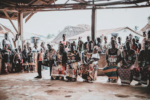 A warm community gathering sharing stories about traditional healing practices.