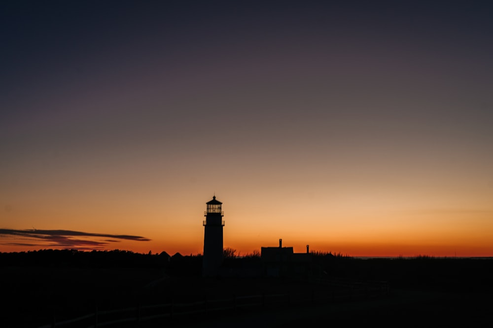 silhouette of watch tower during golden hour