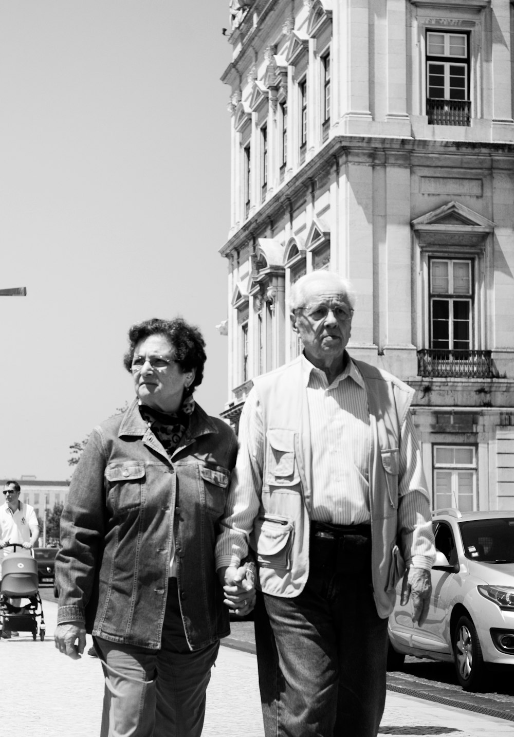 two people walking on street