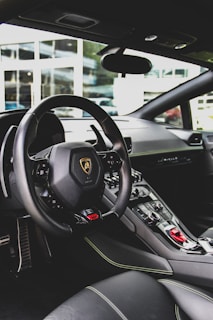 black Lamborghini vehicle interior during daytime