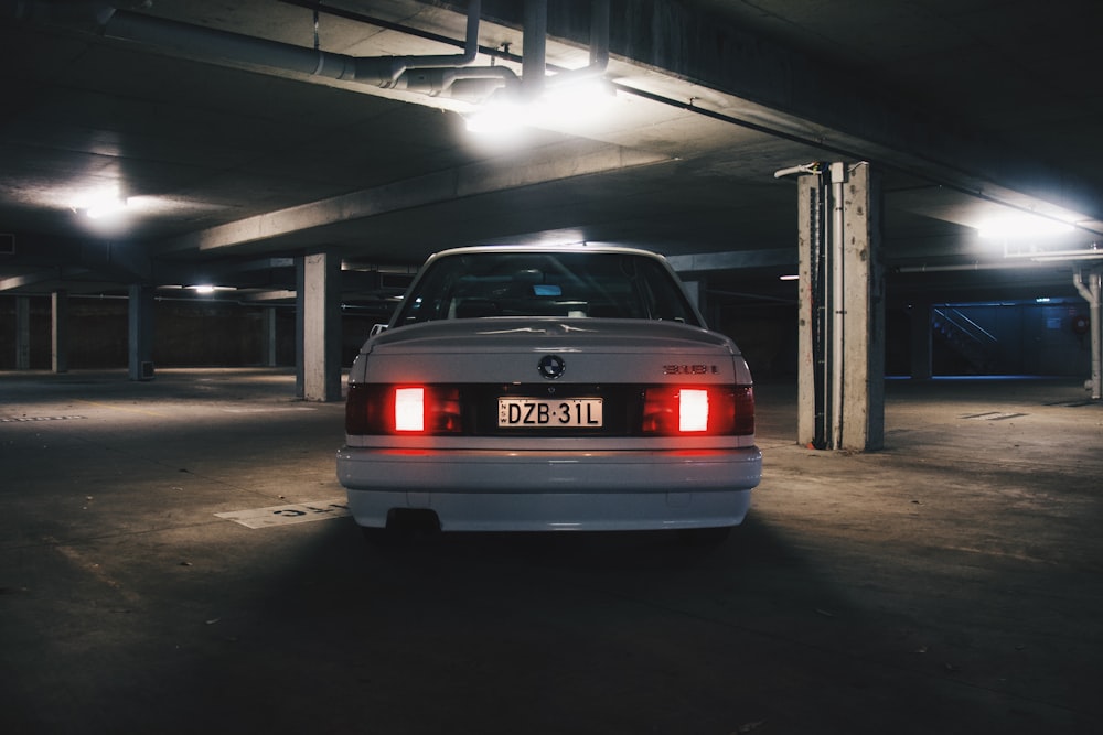 white BMW vehicle on parking lot