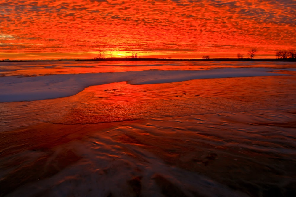 body of water during golden hour