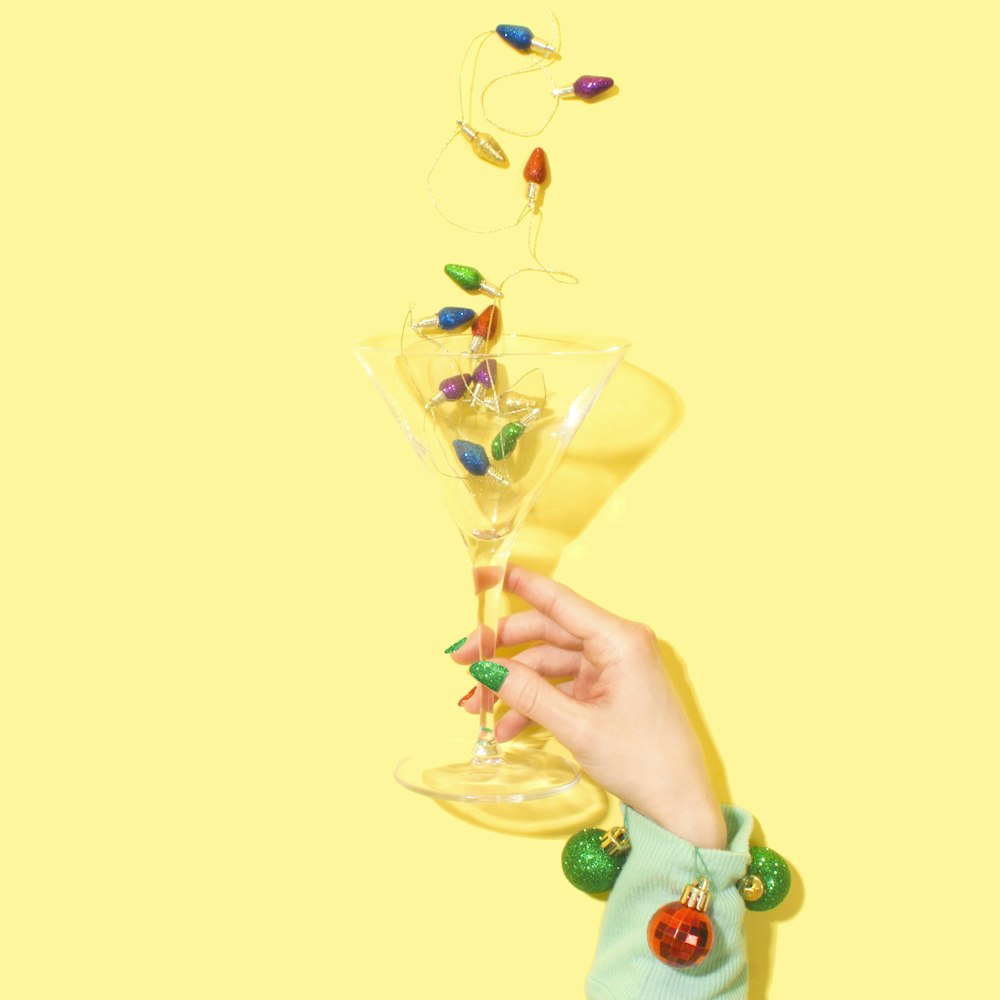 person holding cocktail glass