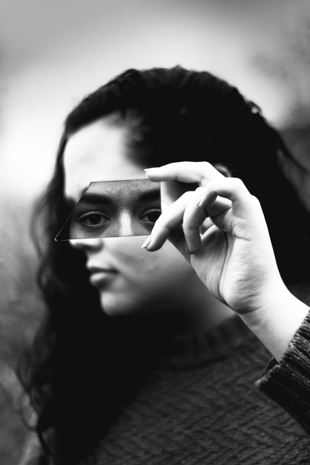 monochrome photography of woman holding glass