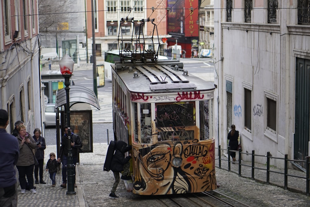 person enter tram during daytime