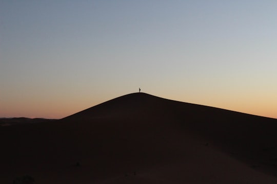 person on desert in Erg Chegaga Morocco