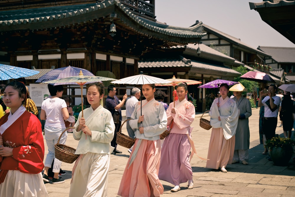 women holding oil paper umbrellas