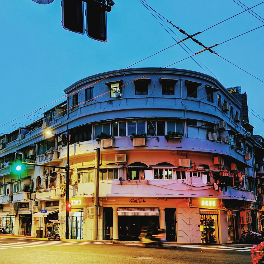 gray concrete building on corner road