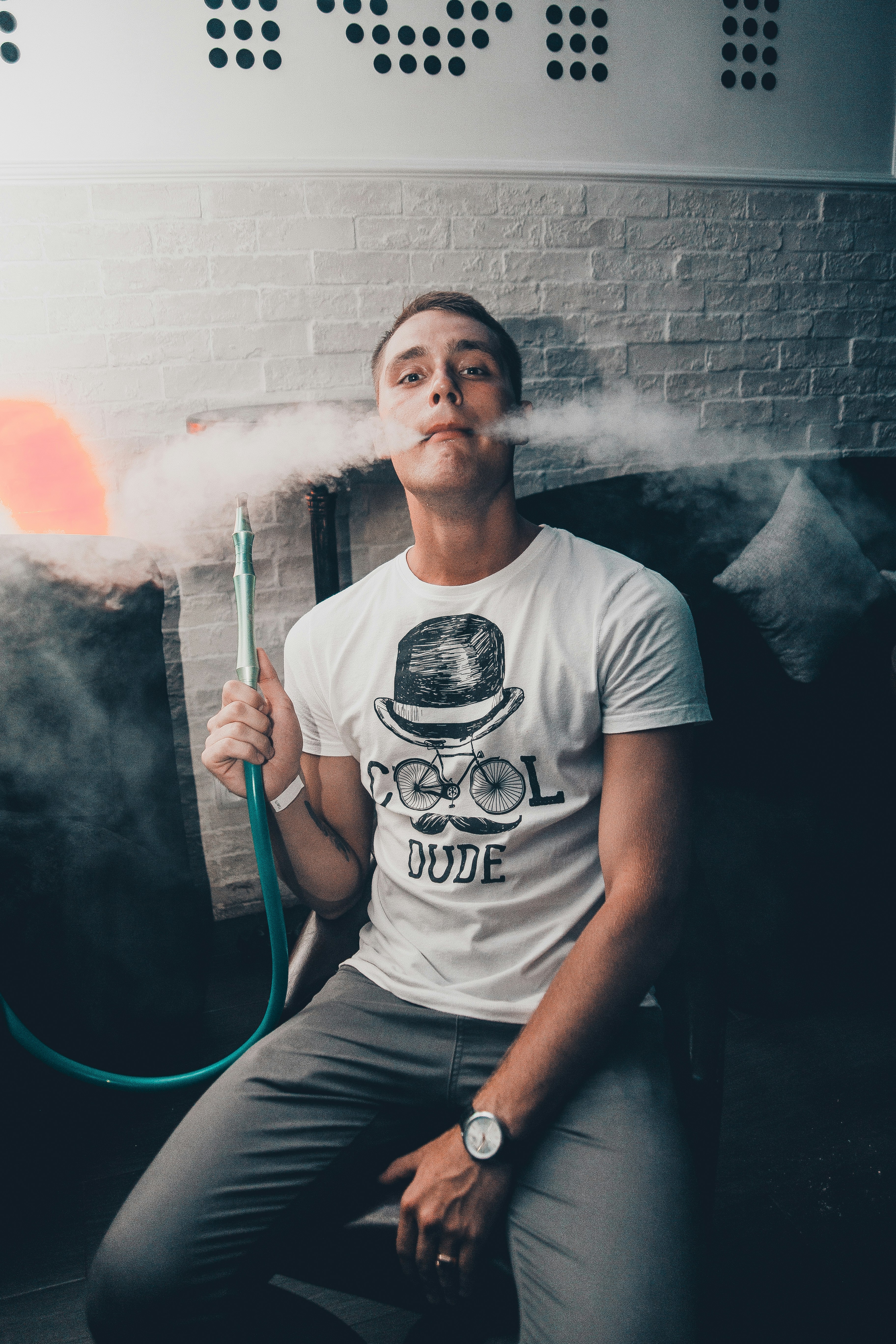 man sitting while vaping