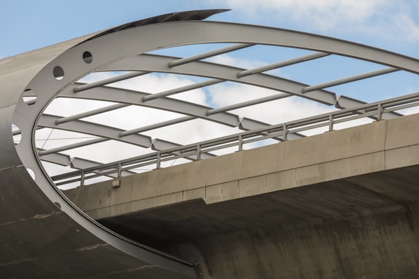 Wide shot of a newly constructed bridge showcasing sleek, sturdy design against a blue sky