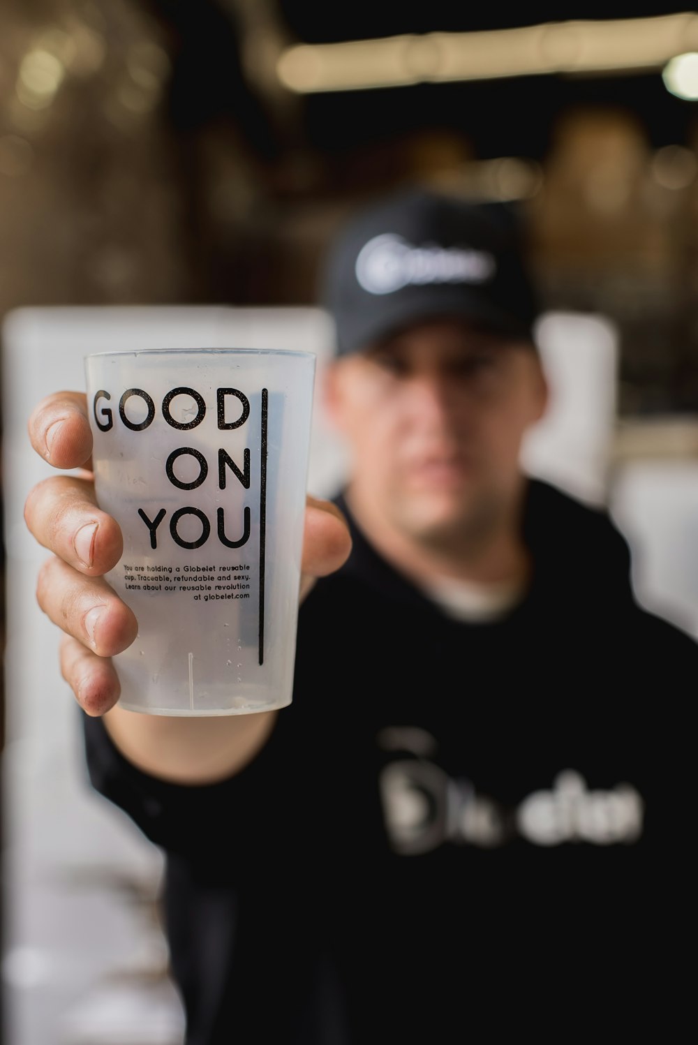 man holding drinking glass