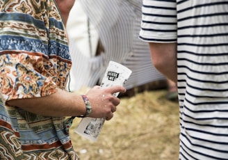 person holding white paper