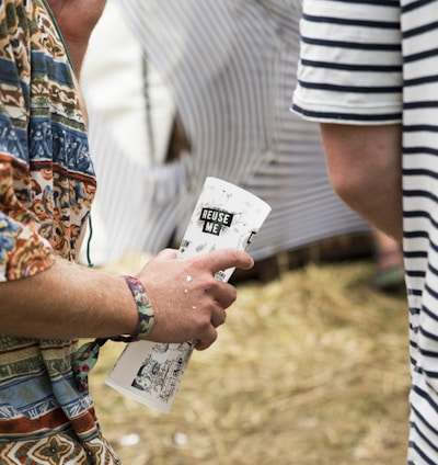 person holding white paper