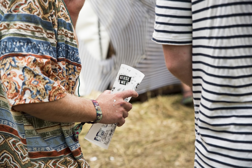 person holding white paper