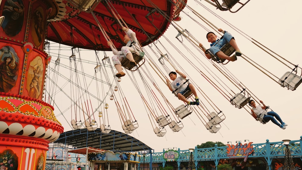 children riding merry go round