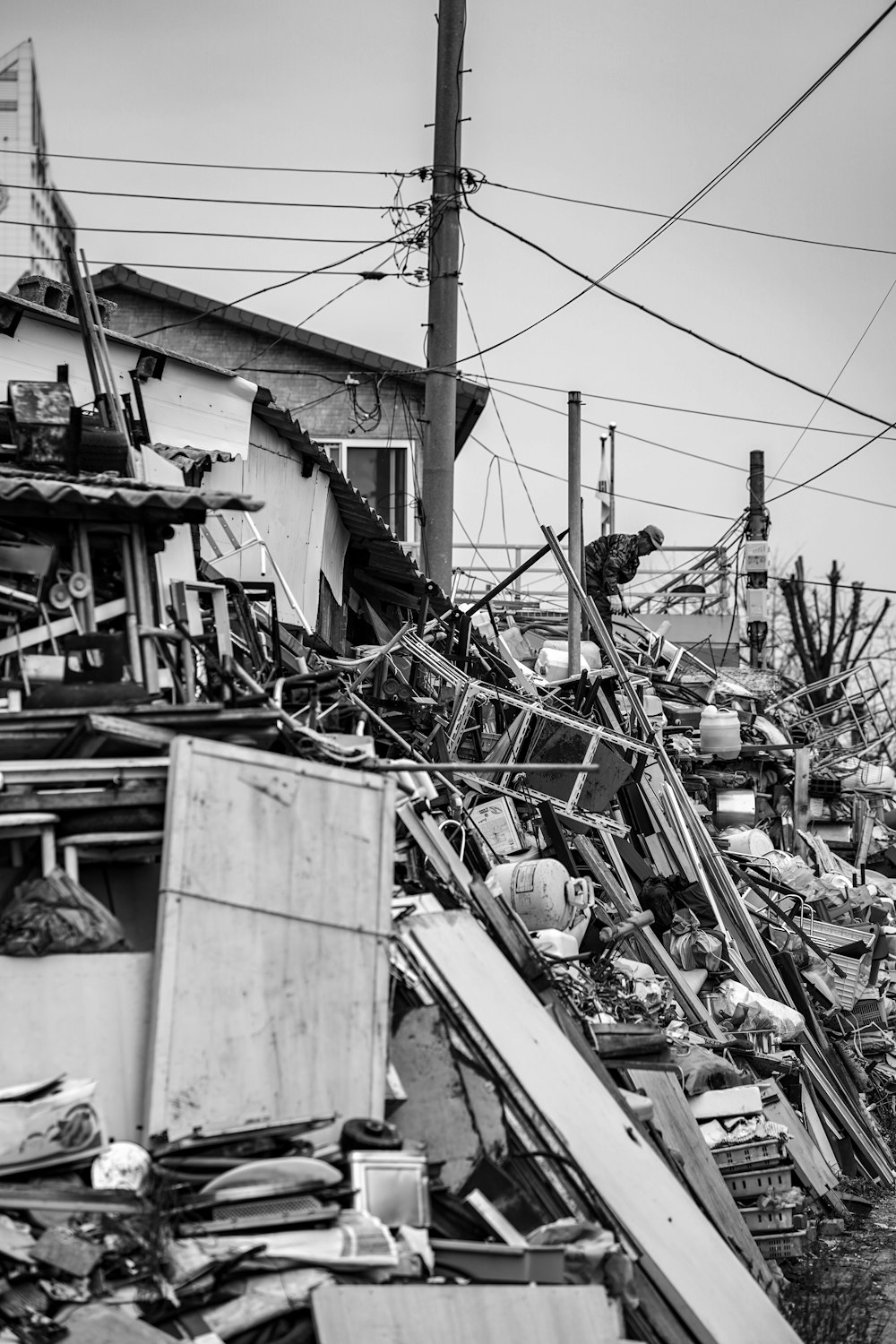 grayscale photography of wreckage of houses