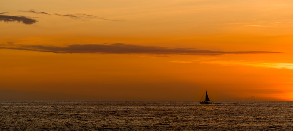 silhouette of sailboat on sea
