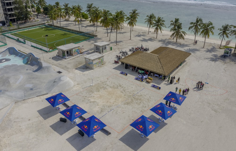 aerial photography of huts near sea