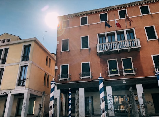 brown and white concrete building in San Croce Italy