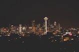 Evening view of Seattle’s skyline with the Space Needle glowing.