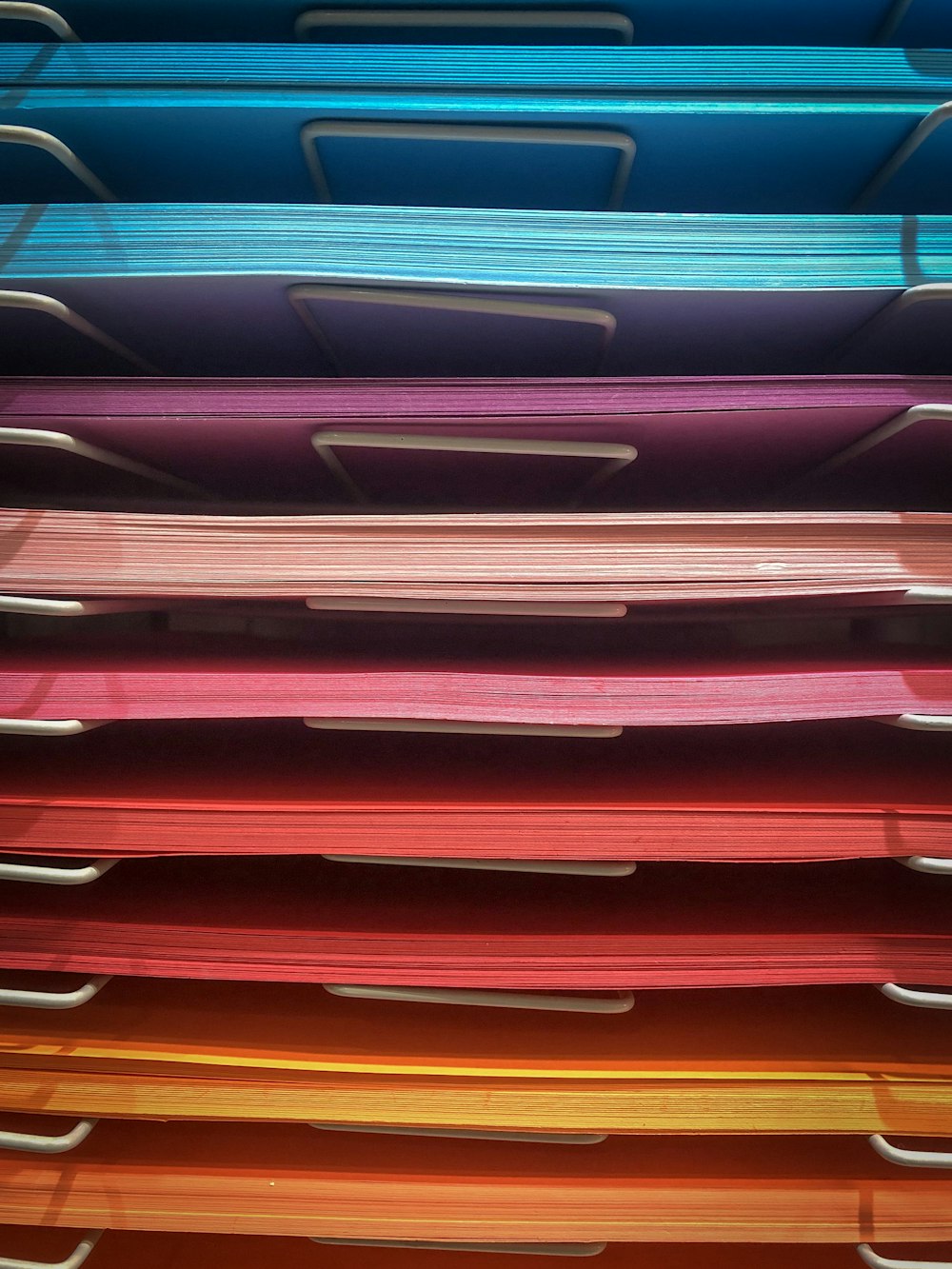 pile of assorted-color papers