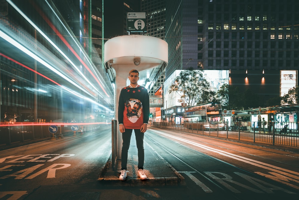 man stands at the center island with time lapse photography