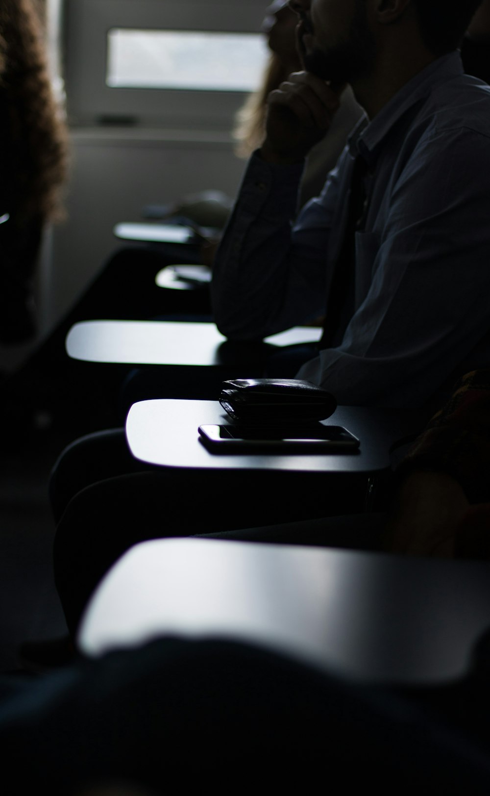 selective focus photo of black seat armrest