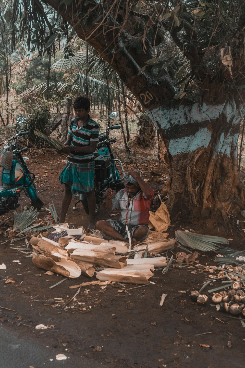 two men cutting woods