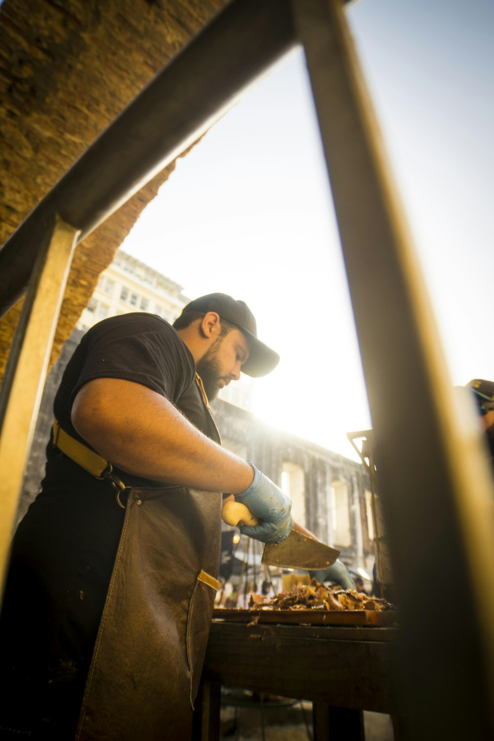 man slicing meat