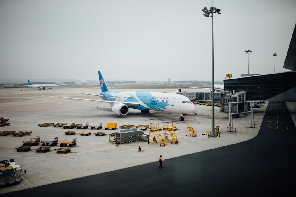 white and blue airplane