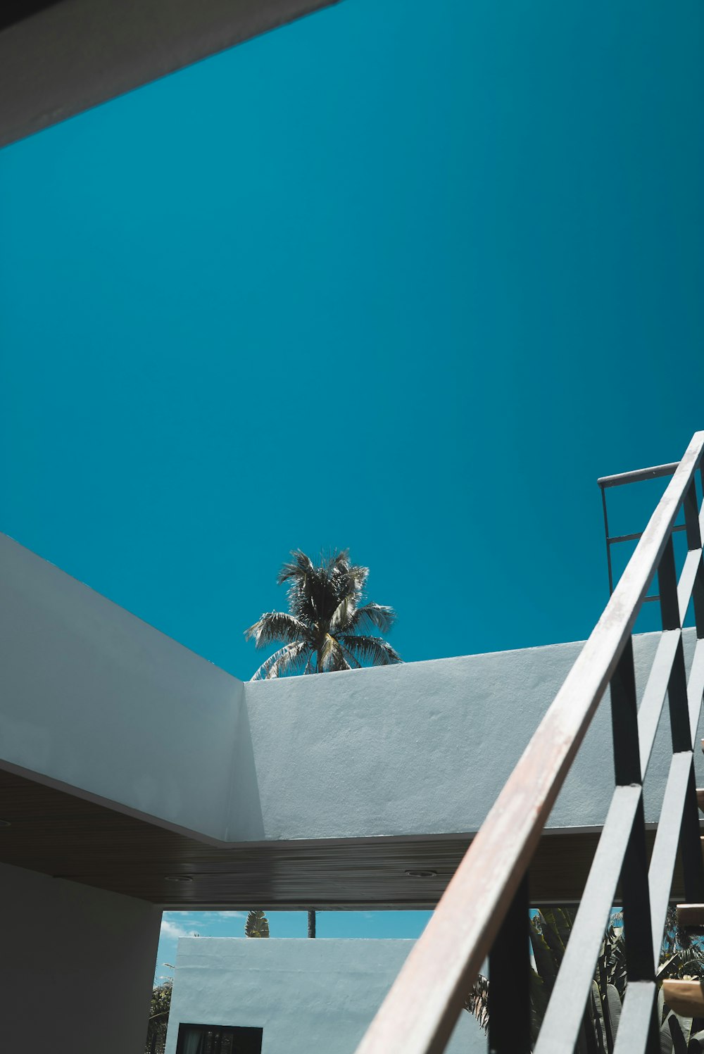 gray stair under blue sky during daytime