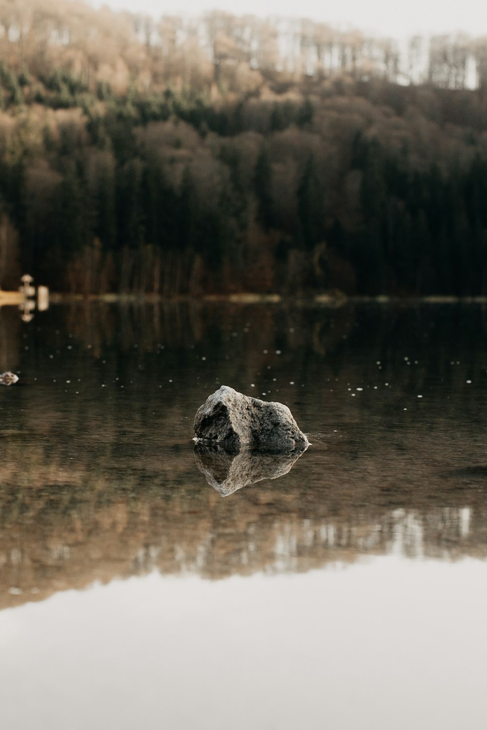 black stone on body of water during daytime