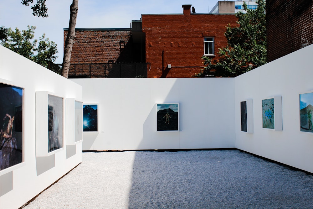 white painted wall with paintings