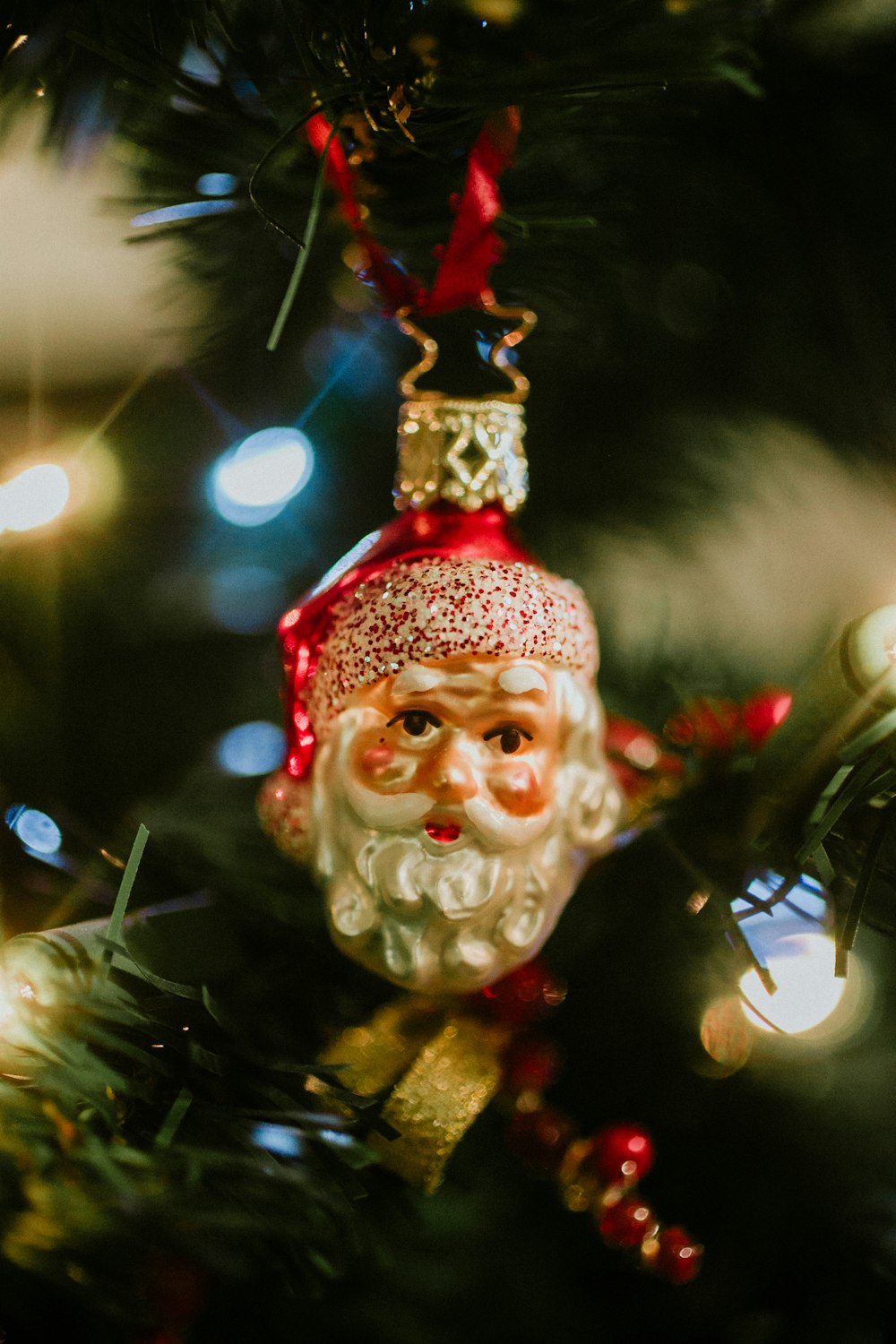 Santa Claus Christmas ornament hanging on tree