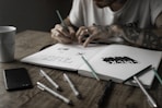 person writing on book