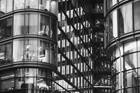 Contemporary commercial office space with glass facade in a bustling Abu Dhabi district.